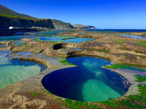 These bizarre figure eight–shaped pools are hidden in the Royal National Park in Sydney, Australia. While they might look man-made, the formations are entirely natural and can only be reached by a difficult hiking track through dense bushland.  Insider tip: Check the tide before embarking on a hike. The Figure Eight Pools are only accessible at low tide when the nearby ocean is calm. In March, a freak wave injured more than 50 people swimming in the pools, so be careful when standing near the ro Natural Pool, Swimming Holes, Figure 8, Hobart, Magical Places, Australia Travel, Pretty Places, New South Wales, Elizabeth Ii