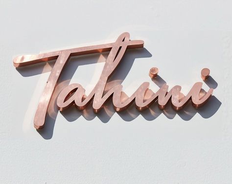 DesignLSM on Instagram: “Cooper signage design for @eat_tahini #brandingbydlsm #restaurantsignage #tahini #harpenden #hospitalitydesign” Copper Signage, Restaurant Signage, 3d Typography, Wayfinding Signage, Environmental Graphics, Signage Design, Hospitality Design, Tahini, Shop Signs