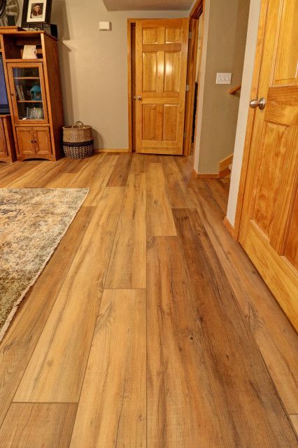 Laminate Wood Flooring With Oak Trim, Coretec Virtue Oak Flooring, Coretec Virtue Oak, Vinyl Plank Flooring With Honey Oak Trim, Vinyl Plank With Oak Cabinets, Honey Oak Lvp Flooring, Luxury Vinyl Basement Flooring, Virtue Oak Floors, Vinyl Plank Flooring With Oak Trim