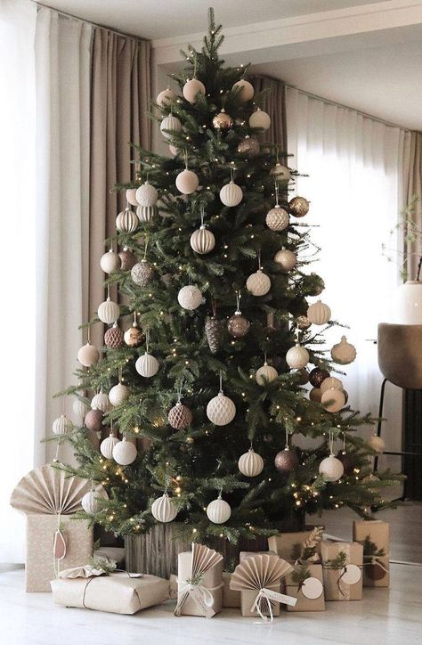 Elevate your holiday spirit by decorating your Christmas tree with love and joy, turning your home into a festive haven of warmth and celebration. #christmastree #christmastreeidea #christmasdecorideas #christmastreethemes #christmastreedecorideas #christmastreeideas2023 #christmastreedecorations Home Christmas Tree Ideas, Designer Trees Christmas, Modern Tree Decor, Christmas Decor Modern House, Christmas Tree 2024 Ideas, Christmas Tree Decorating Ideas 2024, Christmas Tree Inspo 2024, Christmas Decor Ideas 2024, Christmas Tree Ideas 2024