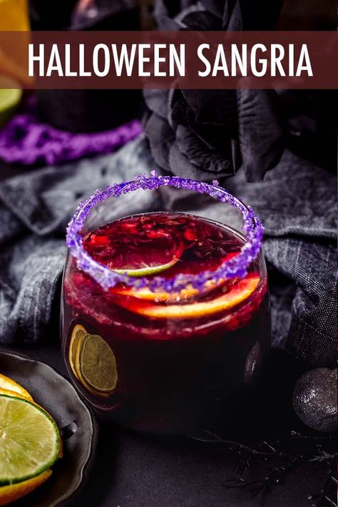 This spooky Halloween sangria is made with seasonal fruit, garnished with a colorful sugar rim, and is the perfect addition to your Halloween party spread. via @frshaprilflours Halloween Sangria Recipes, Halloween Drinks For Adults, Spooky Sangria, Sangria Recipes Easy, Halloween Sangria, Halloween Drink Recipes, Halloween Cheesecake, Blackberry Sangria, Halloween Recipes Drinks