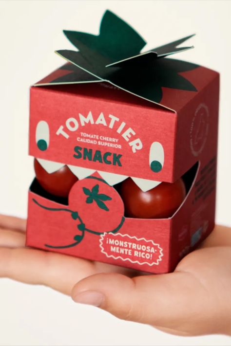 Meteorito hits a double whammy with their extremely cute design for Tomatier Snack’s cherry tomatoes: it looks like a little tomato with its smart red box and green, leafy tabs—and it looks like a little guy! Who doesn’t love a little guy? Pet Packaging Design, Packaging Box Design, Apple Picture, Monster Box, Visuell Identitet, Packaging Design Trends, Cool Packaging, Branding Design Packaging, Food Box