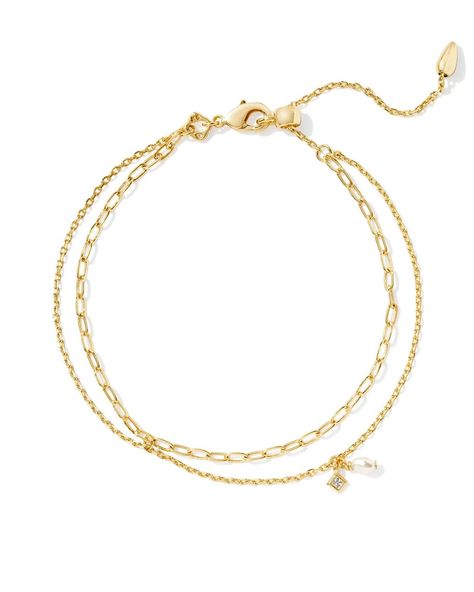 Stack up a style that’s dainty, chic, and full of shine with the Kendra Scott Eve Gold Multi Strand Bracelet in White Pearl. https://thetwistedchandelier.com/products/kendra-scott-eve-multi-strand-bracelet-gold-white-pearl Kendra Scott Gold Bracelet, Kendra Scott Charm Bracelet, Kendra Scott Bracelet Stack, Types Of Chains, Wishlist Ideas, Kendra Scott Bracelet, White Pearl Bracelet, Kendra Scott Necklace, Copper Pearl