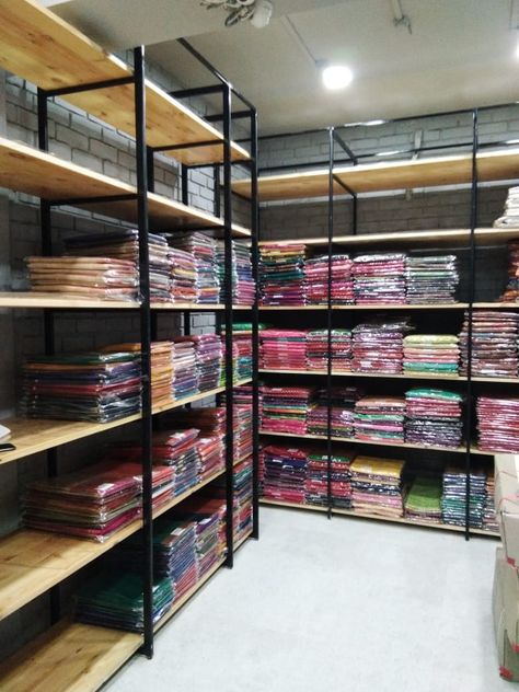 industrial style racks for a saree shop Shop Rack Design, Saree Shop Interior Design, Garment Shop Interior Design, Botique Interiors Ideas, Saree Showroom, Botique Interiors, Clothing Boutique Ideas, Bad Room Design, Shop Counter Design