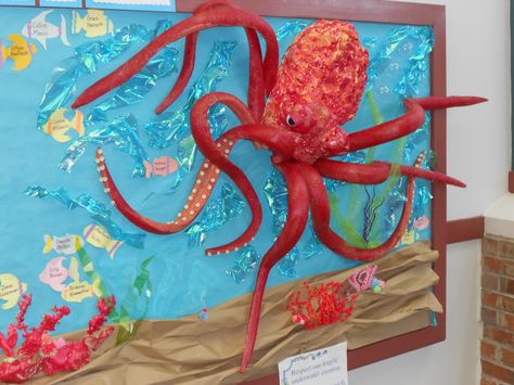 Under the Sea theme Bulletin Board. Octopus made with pool noodles and spray foam insulation. Sea Bulletin Board, Deep Sea Discovery Vbs, Submerged Vbs, Ocean Vbs, Weird Animals Vbs, Ocean Classroom, Under The Sea Decorations, Cute Bulletin Boards, Ocean Theme Classroom