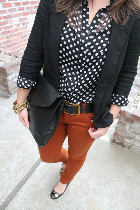 Polka dots and orange pants - just in time for fall :) Outfit With Rust Colored Pants, Black White Polka Dot Shirt Outfit, Rust Colored Pants Outfit Work, Cinnamon Pants Outfit, What To Wear With Rust Colored Pants, Rust Brown Pants Outfit, Rust Trousers Outfit, Rust Pants Outfit Work, Burnt Orange Outfit Color Combos