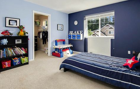 Kids bedroom with light blue walls and dark blue accent wall Light Blue Walls With Accent Wall, Two Tone Blue Bedroom Walls, Boys Bedroom Blue Walls, Accent Wall In Kids Bedroom, Baby Blue Accent Wall, Blue Room For Boys, Blue Boys Room Ideas, Dark Blue Kids Room, Dark Blue Wall Paint