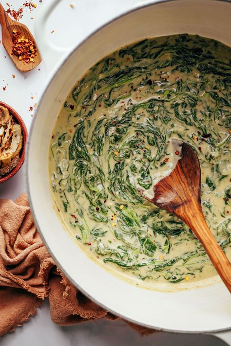 Wooden spoon in a Dutch oven with vegan creamed spinach Vegan Creamed Spinach Recipe, Vegan Meals With Spinach, Vegan Creamed Spinach, Spinach Cream Sauce, Creamy Spinach Sauce, Aesthetic Presentation, Crispy Fried Onions, Spinach Sauce, Tofu Vegan