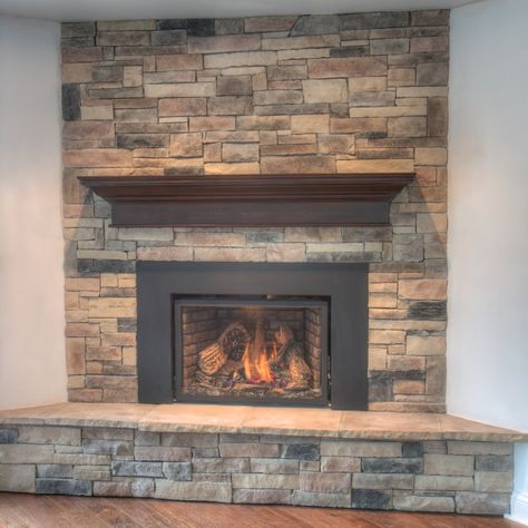 Take your fireplaces to the next level with our most textured mountain ledge stone veneer. Add lighting over the stone wall to create unique shadows on the stone and enhance the appearance. Check out more of our stone veneer at www.northstarstone.biz Veneer Wall Design, Stone Veneer Gas Fireplace, Manufactured Stone Fireplace, Faux Rock Fireplace Stone Veneer, Versetta Stone Sterling Fireplace, Ledge Stone Fireplace, Rockmount Stacked Stone Fireplace, Genstone Faux Stone Fireplace, Veneer Fireplace