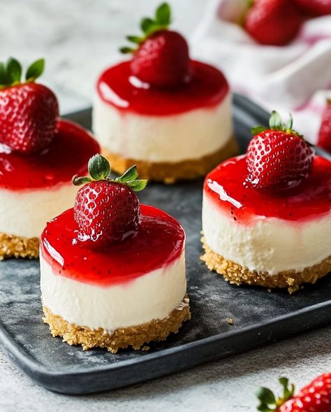 Mini Strawberry Cheesecakes are the perfect bite-sized treat for any occasion. These creamy, rich cheesecakes sit atop a buttery graham cracker crust and are topped with a luscious strawberry sauce. ... Read more Mini Strawberry Swirl Cheesecake, Diy Mini Cheesecake, Individual Strawberry Cheesecake, How To Make Mini Cheesecakes, Mini Strawberry Cheesecake Bites, Mini Cheesecake Toppings, Pretty Baking Ideas, Mini Strawberry Cheesecake Recipes, Horchata Cheesecake