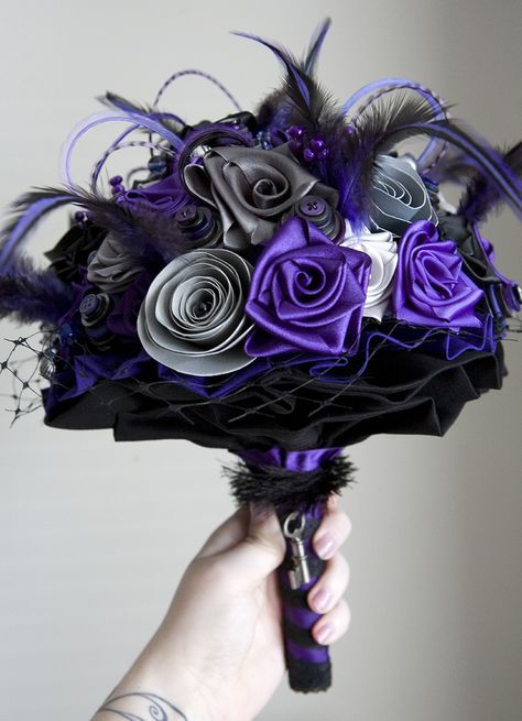 Wedding bouquet purple, black and grey. Ribbons and paper flowers, button stacks, feathers and beads. Wedding Dresses Black And Purple, Purple Suit For Wedding, Black And Purple Tuxedo Wedding, Lavender And Black Wedding Decorations, Blue Purple Black Wedding Theme, Purple Black And Silver Wedding, Black White And Purple Wedding, Purple And Black Wedding Dress, Purple And Black Wedding Theme