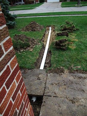 DIY - How to install a drain pipe from the gutter of your house to drain to your backyard.  Pictures of the concrete, burying the pipe, digging the trench, sand backfill and PVC pipe.  Material list and prices.  backfill, cloth, dig, downspout, drain, drainage, gutter, material, pipes, PVC, sand, trench, underground, yard Gutter Drainage Ideas, Drainage Ideas, Downspout Drainage, Gutter Drainage, Backyard Drainage, Yard Drainage, Drainage Solutions, French Drain, Meteor Garden 2018