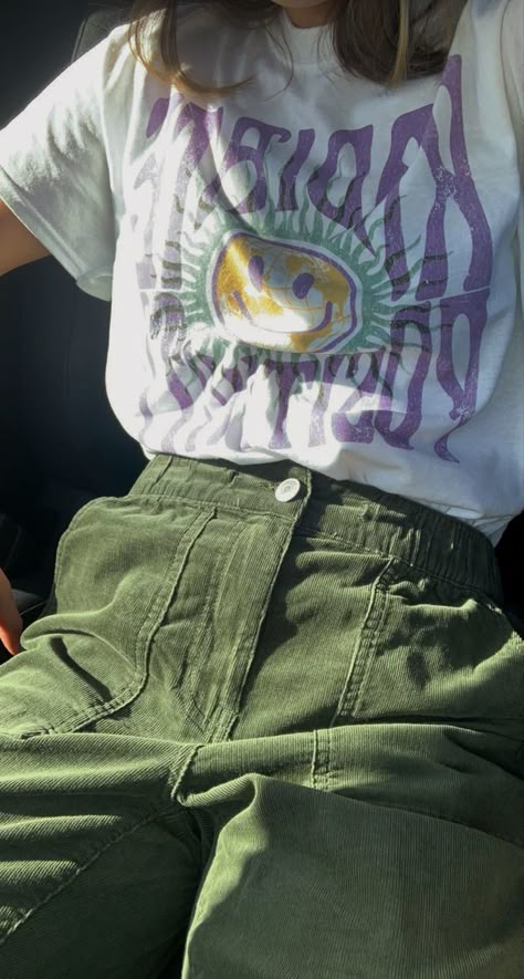 Green Cargo Aesthetic, Purple Cargos Outfits, Dark Purple Pants Outfit Aesthetic, Outfits With Green Corduroy Pants, Green Purple Aesthetic Outfit, Outfit Ideas With Green Shirt, Graphic Tees With Jeans, Purple And Green Outfit Ideas, Green Academia Outfit Summer