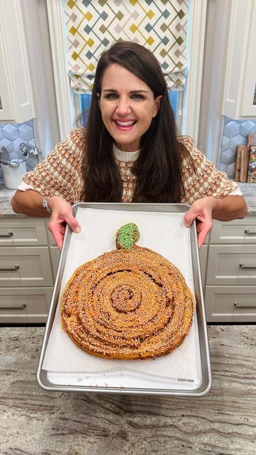 Maegan Brown ~ The BakerMama on Instagram: "GIANT PUMPKIN CINNAMON ROLL 😍🎃😋 Drizzled with pumpkin spice icing and topped with sprinkles, it’s the best way to enjoy a cozy fall morning! HOW-TO BELOW ⬇️ #TheBakerMama

Ingredients:
2 (17.5 ounce) cans Grands! Pumpkin Spice Cinnamon Rolls (10 rolls total)
Pumpkin Spice Icing, from the cinnamon roll cans
Orange sprinkles
Green sprinkles

Instructions:
1. Preheat the oven to 350°F. Line a large sheet pan with parchment paper.
2. Place a cinnamon roll in the center of the pan. Then, working outwards, carefully unravel each of the remaining cinnamon rolls and wrap it around the center cinnamon roll to create a large round spiral of cinnamon rolls. 
3. Shape the end of the last cinnamon roll to create the stem on top by folding the last few inch Pumpkin Spice Cinnamon Rolls, Kids Halloween Party Food, Cinnamon Roll Dough, Pumpkin Uses, It's The Great Pumpkin, Giant Pumpkin, Spooky Stuff, Quick Dinners, Bowtie Pasta