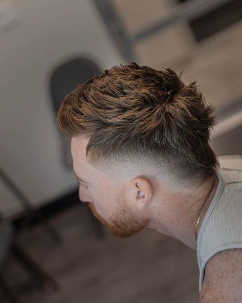 A Mohawk cut with hair extending from front to nape and barely noticeable fading on the sides Cyberpunk Hairstyles, Mid Fade Haircut, Short Hair With Beard, Curly Afro Hair, Round Face Men, Mohawk Hairstyles Men, Gents Hair Style, Mullet Haircut, Faded Hair