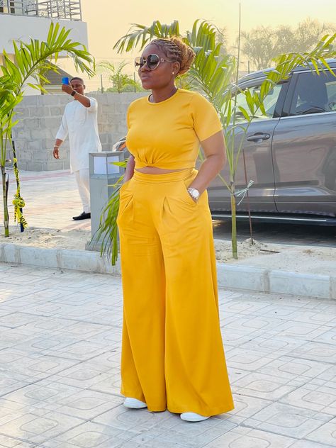 Crop top and a palazzo pants Palazzo Pants Outfit Ankara, Crop Top Two Piece Outfits, Palazzo Pant With Crop Top, Trouser Top Outfit, Crop Top With High Waisted Pants, Chiffon Two Piece Set Pants, Pallazo And Crop Top Outfit, Pallazo Trouser With Top, 2 Piece Outfit Set Pants Crop Tops