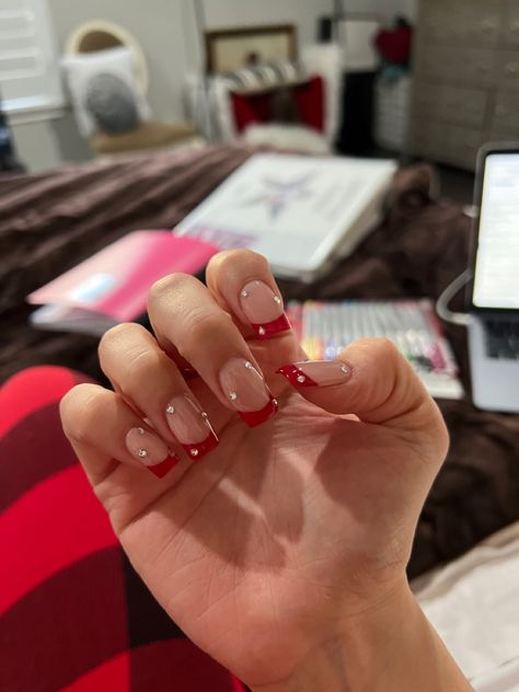 Red French With Diamonds, Dark Red French Tip Nails With Gems, Red Tip Nails With Rhinestones, Red French Tip With Glitter Line, Neon Red French Tip Nails, Red French Tip Nails Almond With Rhinestones, Red Glitter French Tip Nails Short, Red French Tip Nails With Diamonds, Red French Tip With Pearls