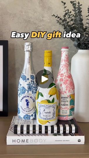 46K views · 677 reactions | Details ➡️ If you have ever searched the internet for heartfelt or handmade gifts, these decoupaged bottles are so special. Whether it is for a hostess, bridesmaid, teacher or girlfriend, these decoupaged bottles are both beautiful and one-of-a-kind. Not only that, they’re both easy and affordable also!Buy a few bottles of bubbly, paint them with any white paint you have laying around your house, glue on the designs or patterns from one pretty napkin and, for a little extra shine, spray on a little paint sealer. Better yet, invite over some girlfriends, and host a DIY night!Let’s just say, if you invite me over, you know what I’ll be bringing!🍾 I’ll post steps and links 🔗 in comments ⤵️ (earns commissions)‼️ #EasyDIYIdeas #diygift #decoupagegift | Shelly Chic Decoupage Gifts, Thrifty Diy, Shine Spray, Easy Diy Gifts, Bottle Painting, White Paint, Spray Painting, White Paints, Diy Gift