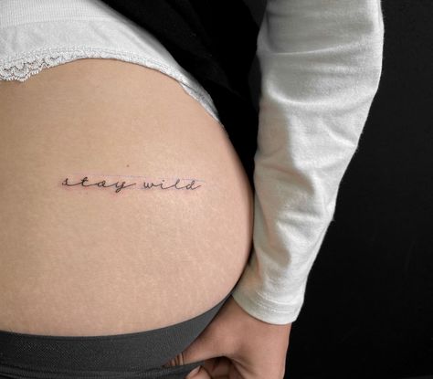 tatoo meaning . Stay Wild Hip Tattoo, Stay Wild Buttcheek Tattoo, Wild Word Tattoo, Wild One Tattoo, Stay Wild Tattoos For Women, Stay Wild Tattoo Buttcheek, Stay Wild Tattoo Fonts, Lower Back Word Tattoos, But Cheek Tattoo