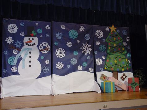 Winter program backdrop; I'd need to shorten these and hang from ceiling to fit in our cafeteria and not block performers Christmas Program Backdrop Ideas, Christmas Play Backdrop, Christmas Program Decorations, Winter Backdrop Ideas, Concert Decorations, Cardboard Snowman, Concert Decor, Christmas Concert Ideas, Diy Christmas Backdrop