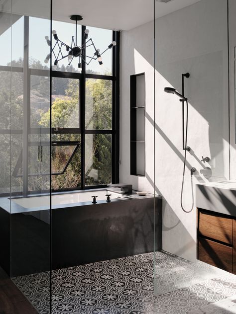 The master bathroom features cement Cigar Shop tiles by Clé Tile. The tub is made of black-honed absolute granite with plumbing ﬁxtures by Dornbracht. The lighting is the Double Octopus by Autoban for De La Espada. San Francisco Houses, Cle Tile, House Extension Design, Street House, Craftsman Bungalows, Cheap Decor, Back To Nature, Simple House, Cheap Home Decor