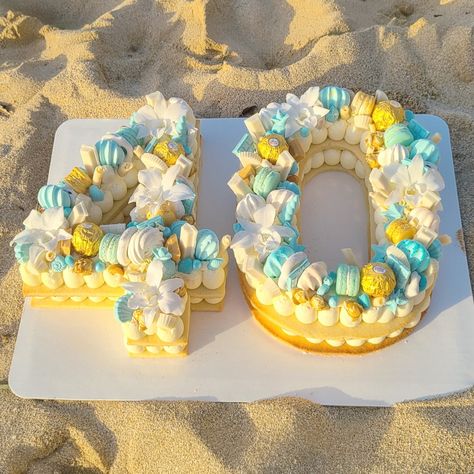 Tropical boho, tropical chic, beach themed, birthday cake.  40th-birthday cake on a beach in Hawaii. Hawaii Birthday Cake, Beach Themed Birthday, Summer Birthday Cake, Beach Birthday Cake, Cake Number, Pool Cake, Macaroon Cake, Beach In Hawaii, 40th Cake