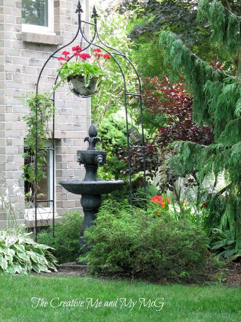 love the use of the arbor-its not leading to anywhere BUT rather frames the birdbath-The Creative Me and My McG: New Blooms and Garden Vignettes Entryway Arch, Day Lillies, Garden Entryway, Garden Vignettes, Garden Archway, Garden Arbor, Backyard Landscape, Garden Rooms, Garden Fountain