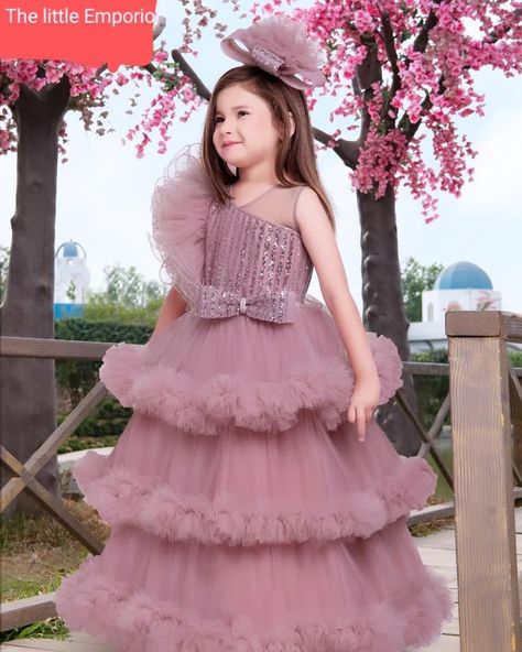 Dress your little princess in this stunning light shimmer gown, designed to make her shine at any special occasion. Featuring a delicate one-side frill sleeve, this gown combines elegance with a touch of whimsy. The soft, shimmering fabric catches the light beautifully, ensuring your child stands out in every crowd.. Speak to us at 9971783109 #KidsFashion #PartyWear #Gown #ShimmerDress #SpecialOccasion #FrillSleeve #KidsStyle #InstaFashion Gown Designs For Kids, Gown For Girls Kids, Child Princess Dress, Kids Gown Design, Gown For Kids, Net Gowns, Shimmer Dress, Kids Gown, Blouse Hand Designs