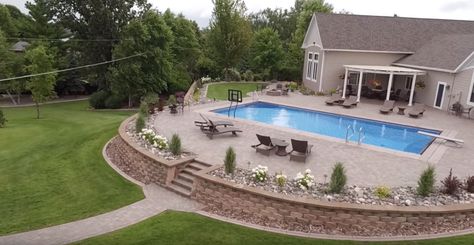 Pool Patio With Retaining Wall, Inground Pools With Retaining Walls, Pool Retaining Wall Ideas Sloped Yard, Pool Landscaping Retaining Wall, Inground Pool Retaining Wall Ideas, Backyard Pool With Retaining Wall, Retaining Wall Around Pool Ideas, Retaining Wall For Pool, Pool Landscaping With Retaining Wall