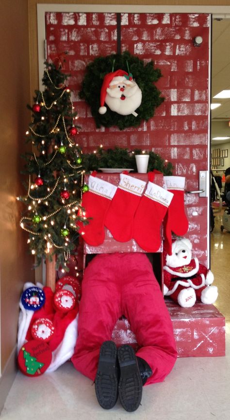 Santa in fireplace. Santa in chimney.  Door decoration. Santa In Chimney Door Decoration, Santa Chimney Door Decoration, Christmas Decorating Contest, Winter Doors, Santa Coming Down The Chimney, Santa In The Chimney, Santa Fireplace, Holiday Classroom Doors, Upcycle Christmas