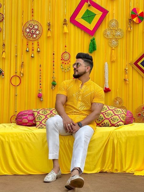 Haldi Dress Man, Groom Haldi Dress Ideas, Haldi Ceremony Of Groom, Haldi Men Poses, Haldi Dress For Men Groom, Haldi Shoot Poses Groom, Haldi Function Decoration For Groom, Hldi Pose For Groom, Haldi Ceremony Decorations For Men