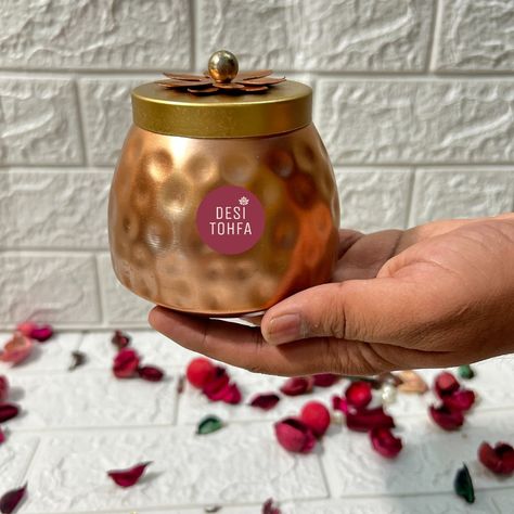 Add a touch of elegance to your gifts with these exquisite Metal Jars with Copper Finish and Lotus Lid. Order now and make every occasion unforgettable! 🫙❤️ ✅Bulk Order Accepted 🌏 Global Fast Shipping Whatsapp at: +91 9680460596 www.desitohfa.com ( metal jars, golden jars, return gifts, wedding favors, housewarming gifts, return gifts and favors, haldi gifts, mehndi gifts, wedding gifts, copper jars, dry fruit jars, chocolates jars, packaging material, indian handicrafts, indian gifts, bul... Housewarming Return Gifts Indian, Jars Packaging, Return Gifts Indian, Housewarming Return Gifts, Chocolate Jar, Fruit Jars, Indian Handicrafts, Indian Gifts, Dry Fruit