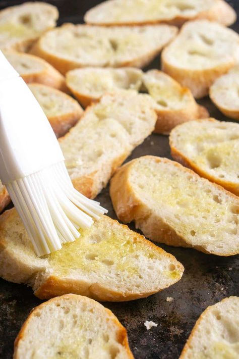 This easy crostini recipe makes a delicious golden, toasted bread base for bruschetta, dips, and other toppings. It's a staple for party appetizers! French Bread Bruschetta, Bruschetta Bread Recipe Appetizers, Toasted Baguette Slices Recipes, Easy Crostini, Crostini Bread, How To Make Crostini, Toasted Baguette Slices, Bruschetta Bread, How To Make Bruschetta