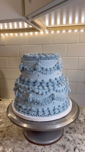 Tay on Instagram: "Glittery blue ✨ #buttercream #buttercreamcakes #buttercreamcake #cake #cakedecorating #cakedesign #wilton #wiltontips #wiltoncakes #austintx #austintexas #austin #texascakes#cakesofinstagram #austincakes#buttercreamdecorating #heartcake #pearlcake #birthdaycake #vintagecake #shellborder #rufflecake #ruffleborder #ediblepearls #y2kcake #shellborder #buttercreamdesign" Sweet Sixteen Cakes Blue, Sweet 16 Winter Wonderland Theme Cake, Blue And White Sweet 16 Cake, Light Blue Cake Ideas, Blue Victorian Cake, Sweet 16 Cakes Blue And Silver, Sweet 16 Cake Ideas Blue, Light Blue Cake Aesthetic, Winter Wonderland Sweet 16 Cake