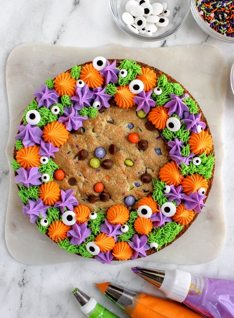 Halloween Loaf Cake Decoration, Number 1 Cookie Cake, Giant Halloween Cookie, Spider Web Cookie Cake, Purple Cookie Cake, Cookie Cake Decorating Ideas Halloween, Halloween Cookie Cake Decorating, Ghost Cookie Cake, Cookie Cakes Birthday Designs