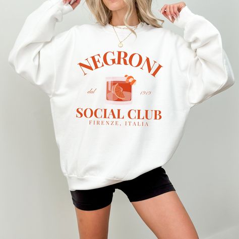 Negroni Social Club Crewneck Sweatshirt | Firenze Italia Italian Cocktail Aperitivo Pullover Sweater | Gift for Her, Him, Trendy Graphic Top by OutOfOfficeAttire on Etsy Outfits Vintage Retro, Aesthetic Tops, Trendy Crewneck, Retro Ski, Bachelorette Outfits, Club Sweatshirts, Trip Outfits, Preppy Aesthetic, Negroni