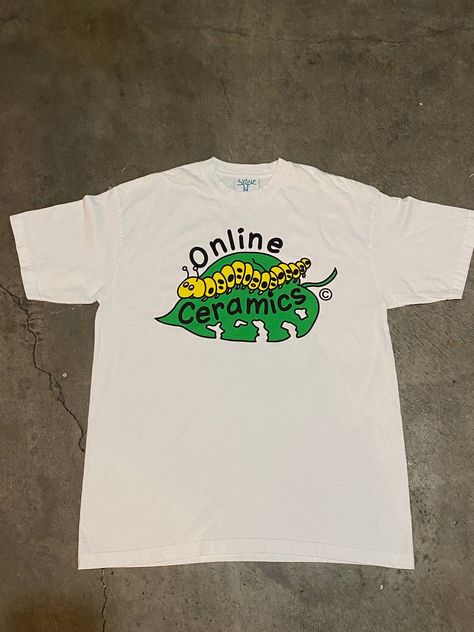 Caterpillar Graphic Design, Online Ceramics Clothing, Online Ceramics, Graphic Design Lessons, Shirt Print Design, Text Pictures, Men's Tops, Logo Tee, Tour T Shirts