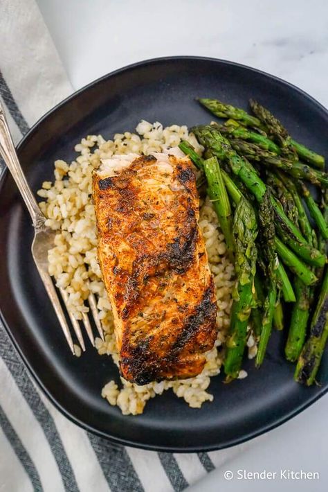 Cajun Salmon with brown rice and grilled asparagus on a black plate. Salmon Dinners, Dinner Low Carb, Cajun Salmon, Paleo Dinners, Louisiana Creole, High Fat Low Carb Recipes, Homemade Seasoning, Slender Kitchen, Brown Rice Recipes