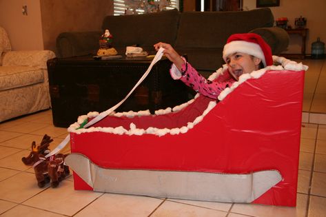 Tori cardboard sleigh | Jaimie Mulheron | Flickr How To Make A Christmas Sleigh, Cardboard Sleigh Diy, Santas Sleigh Diy Cardboard, Cardboard Santa Sleigh, Cardboard Sleigh, Baby Christmas Decorations, Christmas Sleigh Decorations, Christmas Party Activities, Cardboard Christmas