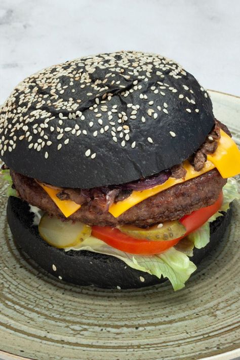 Juicy homemade Black Angus burger in toasted activated charcoal black sesame bun, with crispy onions, wild mushrooms, cheddar cheese. Served medium, with grilled sweet potatoes. Want it delivered? Order it on Foody! Charcoal Burger, Angus Burger, Grilled Sweet Potatoes, Drinks Coffee, Crispy Onions, Black Sesame, The Don, Wild Mushrooms, Activated Charcoal