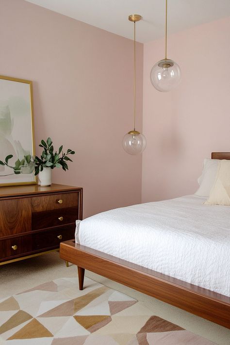 Stylish mid-century modern bedroom featuring pink accents, vintage furniture, and soft lighting. Mid Century Modern Bedroom Pink, Mid Century Eclectic Bedroom, Mid Century Modern Bedroom Ideas, Mauve Bedroom, Mid Century Modern Bedroom Design, Mid Century Bungalow, Modern Bedroom Wardrobe, Pink Mid Century Modern, Pink Bedroom Walls