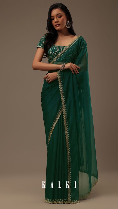 "Introducing our enchanting teal green plain organza saree, a celebration of simplicity and opulent detailing. This saree showcases a cutdana border that adds a touch of elegance. The unstitched blouse fabric features heavy cutdana work all over. EVENT - Perfect for evening parties. The saree comes with a matching unstitched blouse." Plain Green Saree, Teal Green Saree, Teal Saree, Bridesmaid Theme, Green Organza Saree, Engagement Sarees, Farewell Saree, Farewell Dresses, Sangeet Night