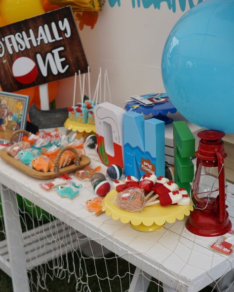 Boys first birthday unique colorful fishing theme. Dessert table decorations. Ofishally One Table Decorations, Officially One Birthday Party, Ofishally One Birthday, Kid Birthday Themes, Dessert Table Decorations, Officially One, Fishing Themed Birthday Party, Fish Theme, O Fish Ally