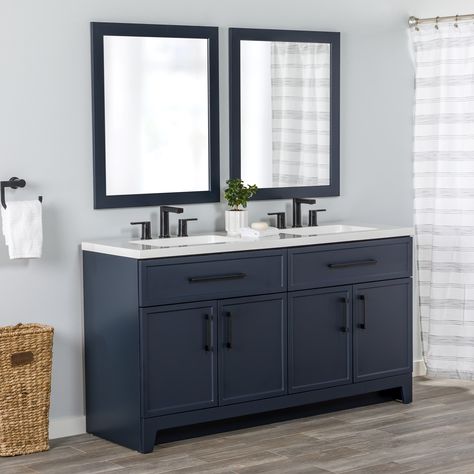 Transform your bathroom with the Potter 60.5-in W deep blue vanity. This double-sink bathroom vanity features a Shaker-style design that’s complemented by a 1-piece white cultured marble sink top and matte black hardware. Pre-assembled and ready to install, this vanity also includes a wraparound drawer with 3 compartments and a 2-door cabinet below each sink for easy-access storage space. This transitional vanity adds style and storage in large and shared bathrooms. Style Selections Potter 60-in Blue Double Sink Bathroom Vanity with White Cultured Marble Top | LW24W60P2-DB Navy Vanity White Tile Bathroom, Blue Double Sink Bathroom Vanity, Bathroom Cabinet Navy, Blue Bathroom Vanity With Black Hardware, Navy Vanity With Black Hardware, 49 Inch Bathroom Vanity, Navy Blue And Grey Bathroom Ideas, Navy Blue Cabinets With Black Hardware, Blue Cabinet Bathroom Ideas