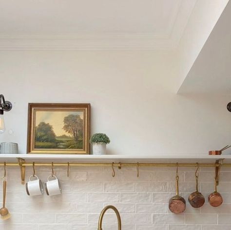 Perrin and Rowe on Instagram: "Whether your kitchen is small or spacious, open shelving offers a fresh and modern approach to storage, which combines aesthetics and functionality. Seen here in @little.leam.home, this beautifully serene kitchen incorporates open shelving and a utensil rail so essential tools are within arm's reach while also keeping worktops clutter free. Painted in @farrowandball Wimborne White, the kitchen includes our aged brass Ionian mixer and rinse along with our Parthia Kitchen Shelves Brass Brackets, Open Shelving Brass Brackets, Kitchen Shelves With Brass Rail, Kitchen Shelf With Rail, Single Open Shelf Kitchen, Brass Rail Kitchen, Howden Kitchen, Kitchen Rail With Hooks, Serene Kitchen