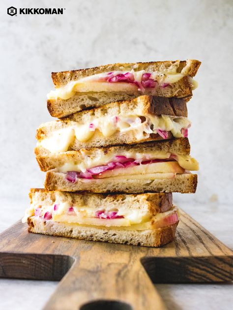 Pickled Red Onion and Apple Grilled Cheese Sandwich | Swap classic grilled cheese sandwiches for this elevated version instead. A comfort food recipe that’s quick to prepare for lunch or as an easy dinner! This recipe turns regular grilled cheese right on its head with a cheesy, melty flavor combination that's out of this world. Cheddar and sweet apple slices are a match made in heaven, and pickled red onion brings a sharper sweetness to the mix. Serve on cold days with a side of soup! #Kikkoman Red Onion Sandwich, Sandwich With Pickled Red Onion, What To Serve With Pickled Red Onions, Pickled Onion Sandwich, Elevated Sandwich Ideas, Regular Cold Sandwich, Elevated Sandwiches, Barbie Dinner, Apple Grilled Cheese