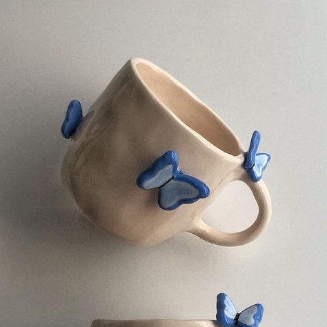 winnie ceramics on Instagram: "butterflies everywhere!🦋💙   • • #handmadeceramics #ceramicmug #mugsofinstagram #cutemug #mugsmugsmugs #handmademug #coffeelover #coffeetime" Butterfly Ceramics, Ceramic Butterfly, Butterfly Mug, Pottery Inspo, Ceramic Ideas, Pottery Ideas, Clay Ceramics, Pottery Mugs, Cute Mugs