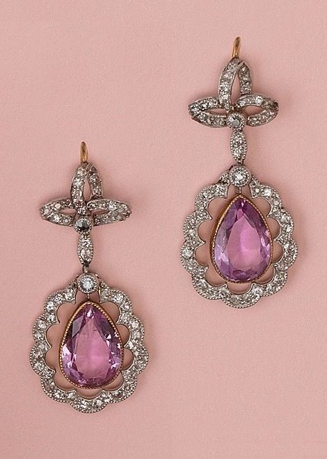 A pair of Edwardian platinum, diamond and pink topaz earrings, English, circa 1910. 1910 Jewelry, Edwardian Vampire, Convertible Jewellery, Edwardian Earrings, Convertible Jewelry, Pink Topaz Earrings, Antique Diamond Jewelry, Pink Sapphire Earrings, 3 Earrings