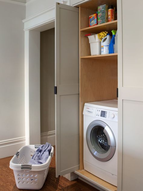 Fit a makeshift laundry room into a collection of cabinets, such as those in a kitchen, to hide these hardworking appliances in plain sight. The doors to this laundry area open and slide back into the cabinet, so they don't impede traffic flow. #laundryrooms #smalllaundryrooms #laundryroomideas #bhg Laundry Remodel, Barndo Ideas, Cabinetry Ideas, Traditional Laundry Room, Slim Storage Cabinet, Simple Cabinet, Laundry Doors, Laundry Shelves, Hidden Laundry