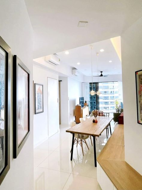 Eclectic Singapore Apartment Tour Photos | Apartment Therapy Dining Table In Hallway, Dining Room White Walls, Long Wood Dining Table, Dining Table With Black Legs, Singapore Apartment, Dining Room White, Flowerpot Pendant, Noguchi Coffee Table, Living/dining Room